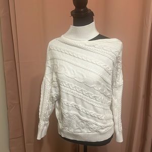 Beautiful, off-the-shoulder sweater in white.